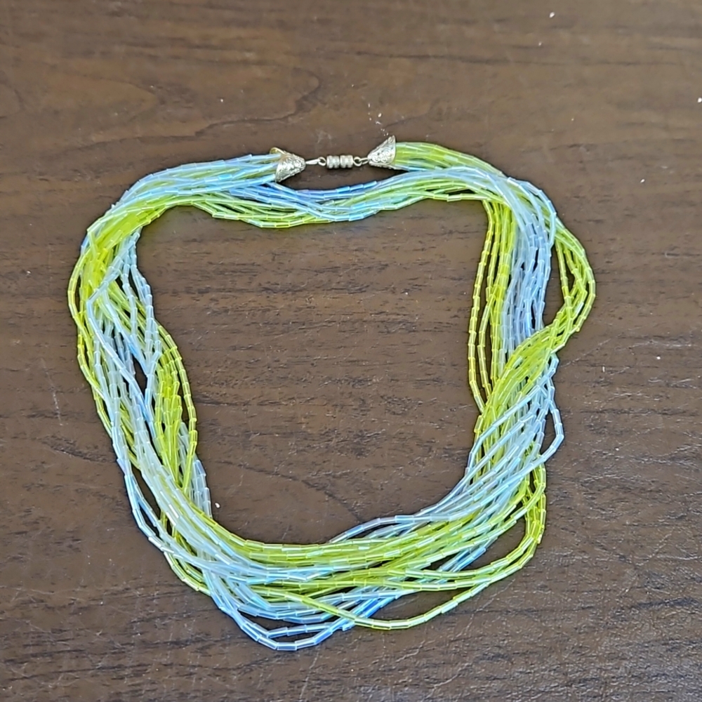 10 Strand Yellow and Clear Plastic Tibe Bead Necklace